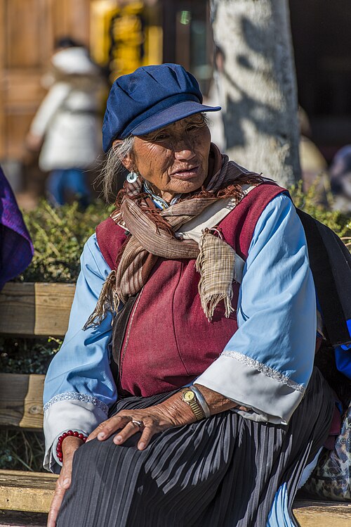 A Naxi elder in traditional dress in Lijiang Old Town